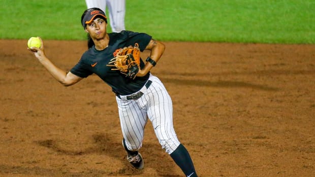 Oklahoma State's Tallen Edwards (44) fields a hit and throws to first during a pre-season softball game between Oklahoma State (OSU) and Tulsa (TU) at Cowgirl Stadium in Stillwater, Okla., on Thursday, Oct. 26, 2023.